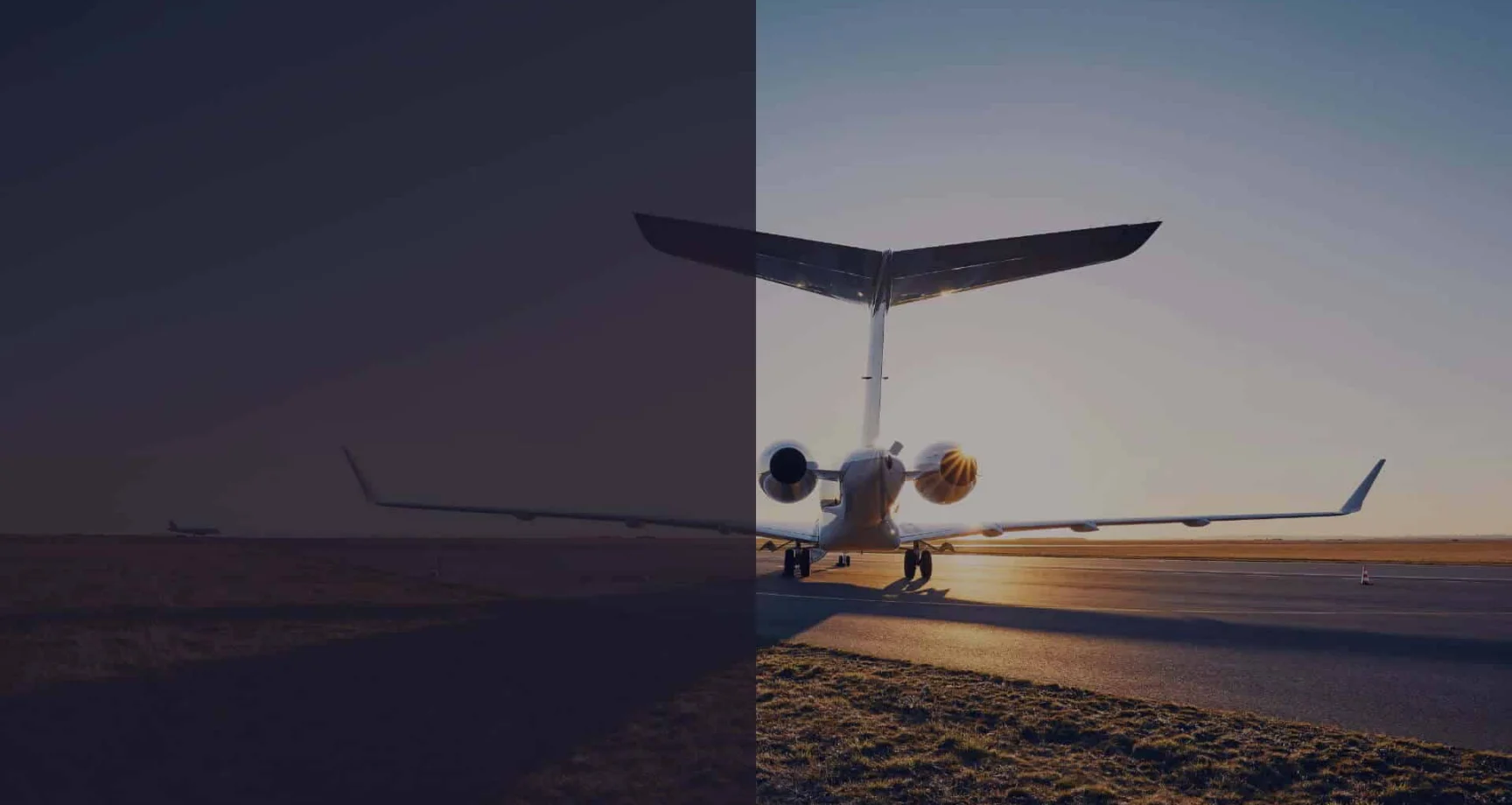 A jet airplane is parked on a runway at sunset, with the left half of the image darkened and the right half brightly lit.