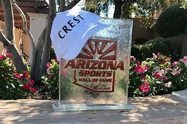 Crest cap resting on an Arizona Sports Hall of Fame glass award