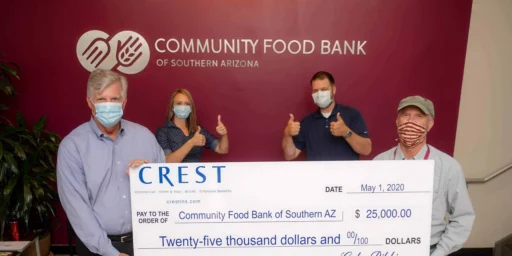 Crest Insurance team presenting a $25,000 check to the Community Food Bank of Southern Arizona