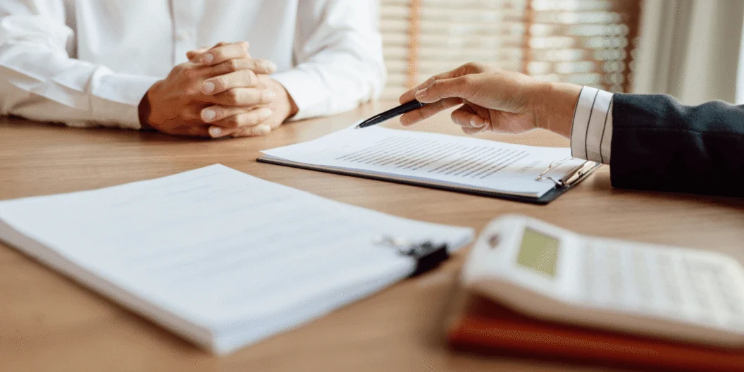 Two people going over a contract