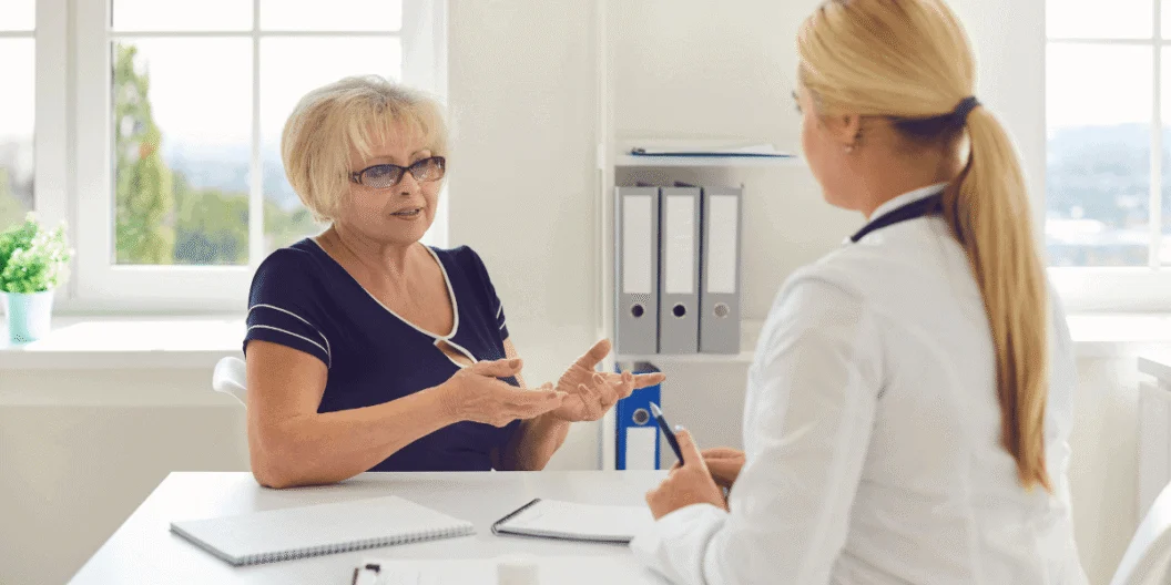 Woman talking to medical professional