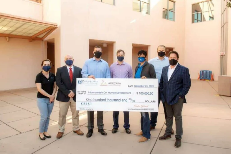 Group presenting a $100,000 check to Intermountain Centers for Human Development