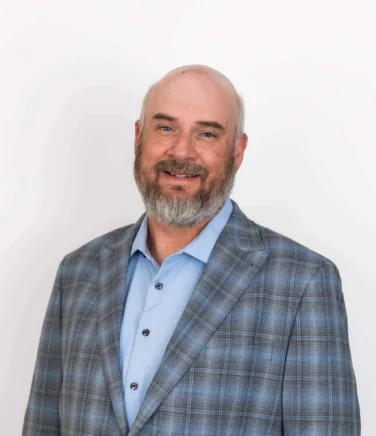 Headshot of Travis Carlson