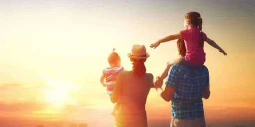 Family with two children watching a sunset
