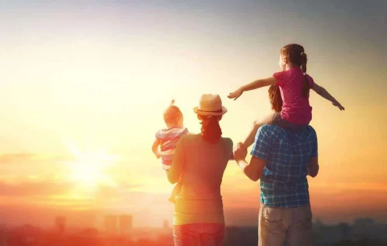 Family with two children watching a sunset